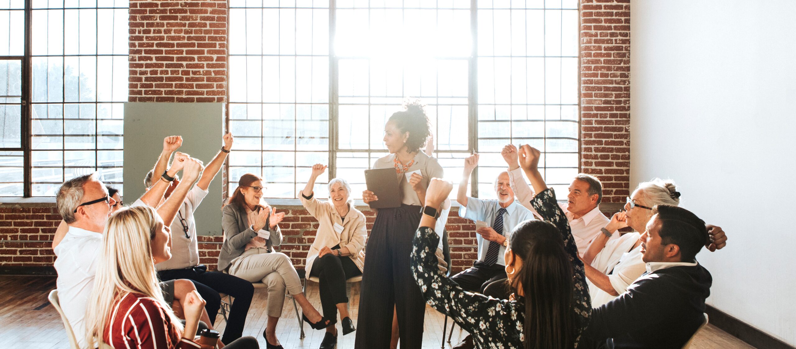 Young businesswoman talking to a crowd